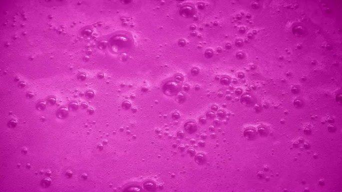 粉红色的嘶嘶表面粉红色泡泡沸腾气泡