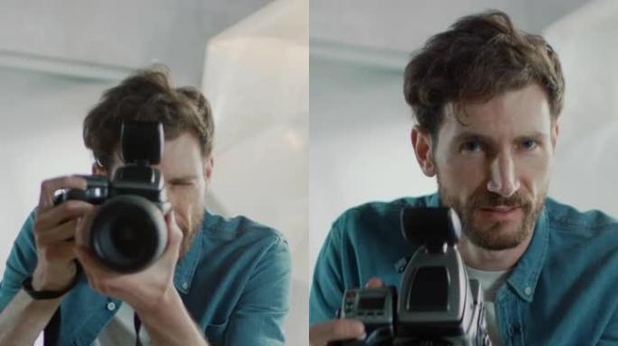 这位英俊的摄影师的肖像拿着最先进的相机，准备在背景中使用柔光箱照明拍照。垂直屏幕方向视频9:16