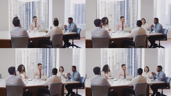 商务专业人士在现代办公室圆桌会议