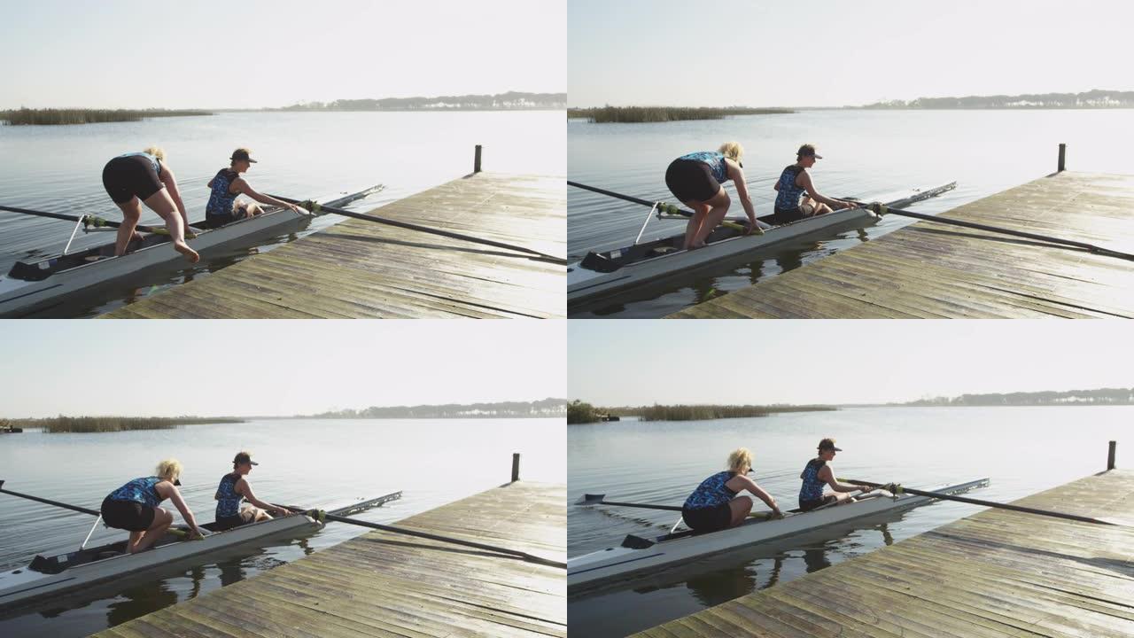 女赛艇运动员在河上训练