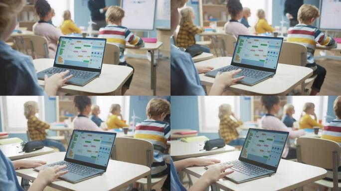 小学科学课: 肩膀上的小男孩使用带有屏幕显示编程软件的笔记本电脑。物理老师向充满聪明孩子的多元化班级
