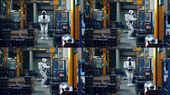 仿生机器人走在工厂的房间里，在平板电脑上打字。