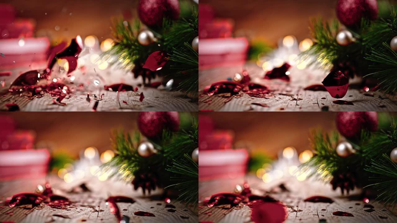 SLO MO圣诞球落在地板上，被压成碎片。