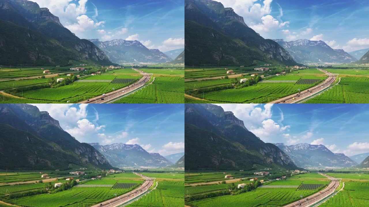 空中无人机视图: 意大利美丽的农田位于山区。高速公路位于山区。葡萄园、橄榄树、各种蔬菜种植地和农业种