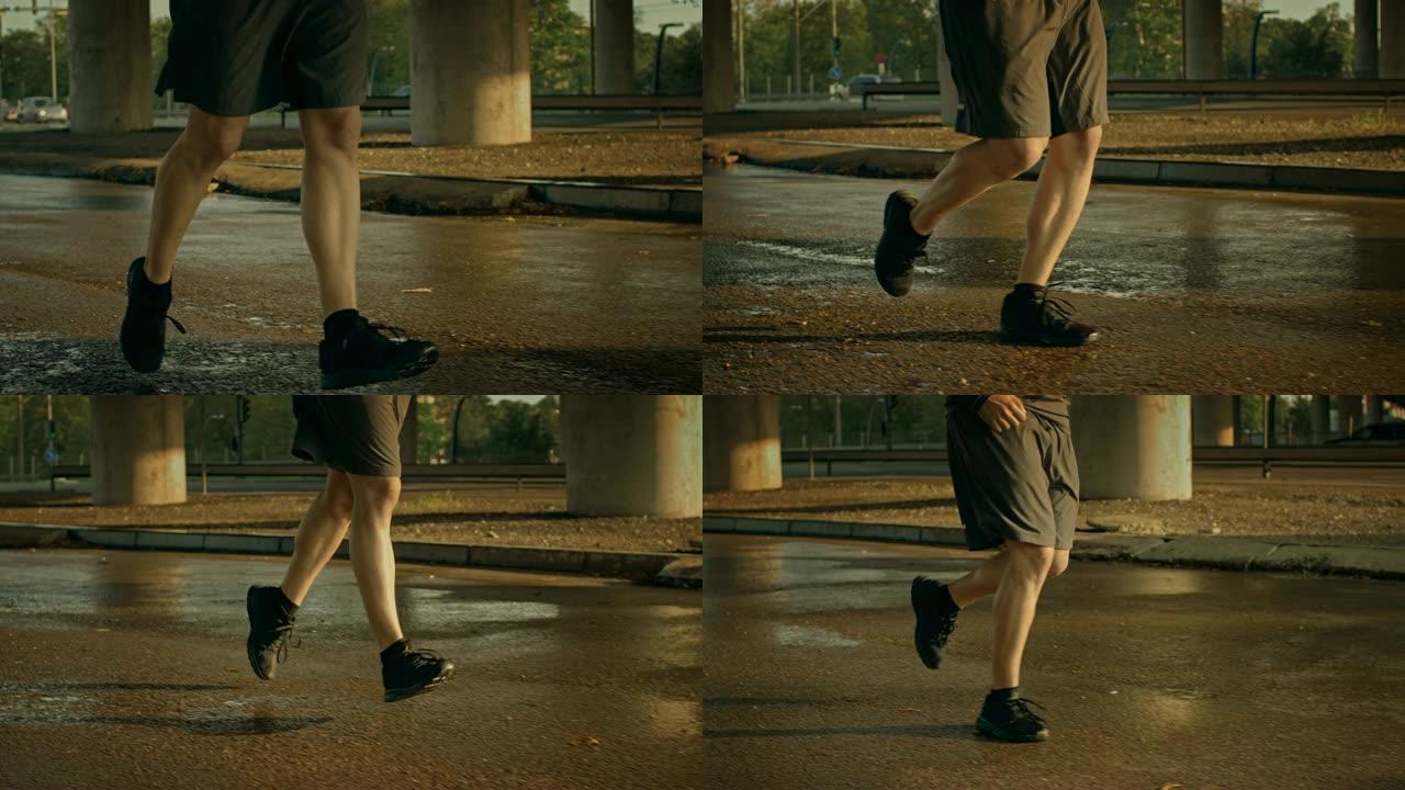 特写镜头，一个穿着运动服的年轻男子在街上慢跑。他在城市环境中奔跑，背景是汽车。