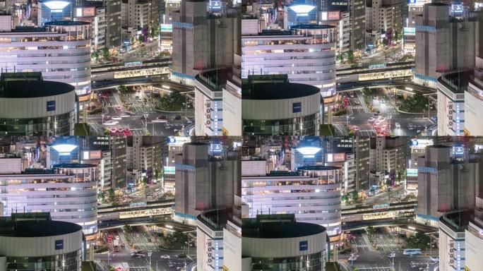 延时: 神户市景和火车站的鸟瞰图，夜间提供交通工具。