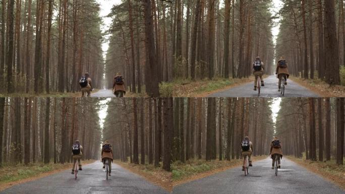 雨中夫妇骑自行车穿过森林的后视图