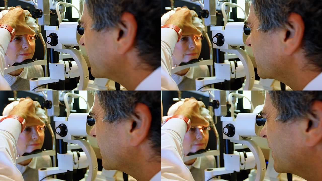 验光师用裂隙灯4k检查患者的眼睛