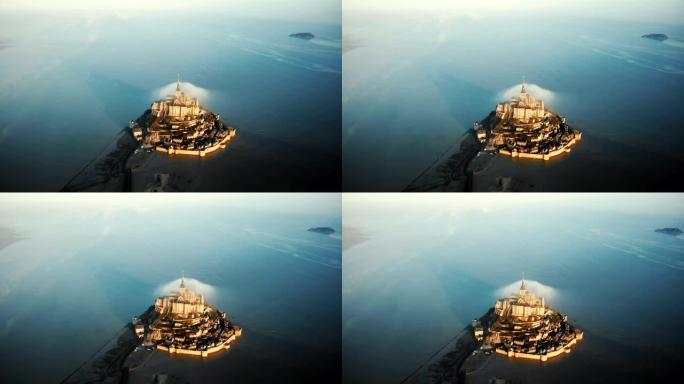 无人驾驶飞机在诺曼底海潮环绕的虚幻城堡岛上雄伟的日出圣米歇尔山上空飞得很高