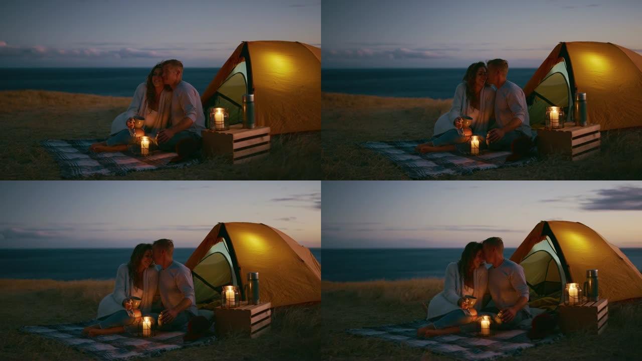 夫妇享受亲密的烛光露营浪漫