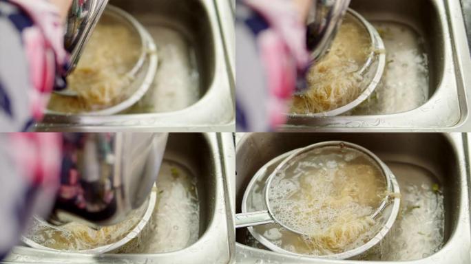 亚洲家庭主妇在锅里煮鸡蛋面的4k镜头