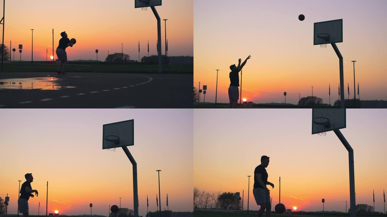 年轻男子女士在日落时在室外篮球场打篮球