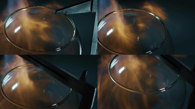 玻璃鼓风机的慢动作宏在车间的珍贵水晶手工制作的玻璃艺术品上与火焰一起工作。