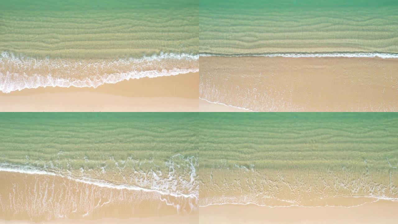 到达海岸线的绿松石海浪的鸟瞰图