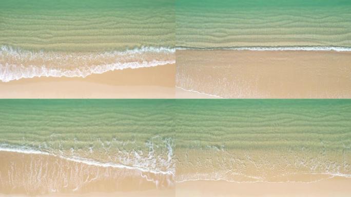 到达海岸线的绿松石海浪的鸟瞰图