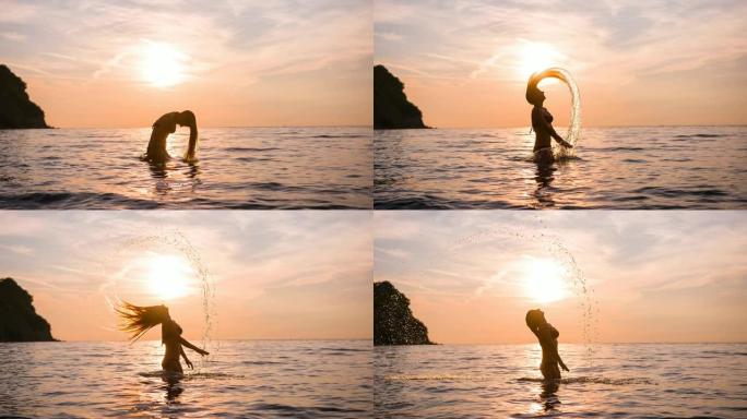 海上日落，女人在热带度假中玩乐，用头发泼水