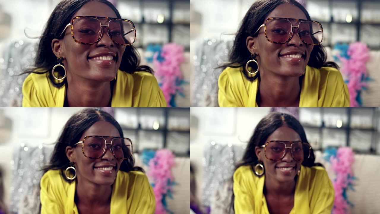 非洲种族女性对着相机做鬼脸。有趣的眼镜