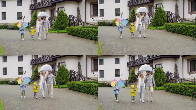 家庭在雨天行走