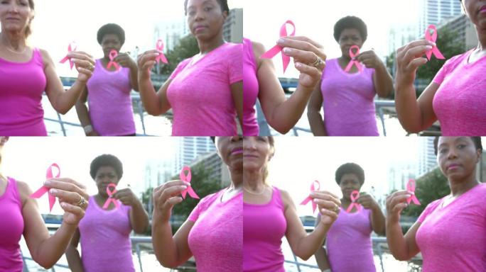 妇女手持乳腺癌意识丝带