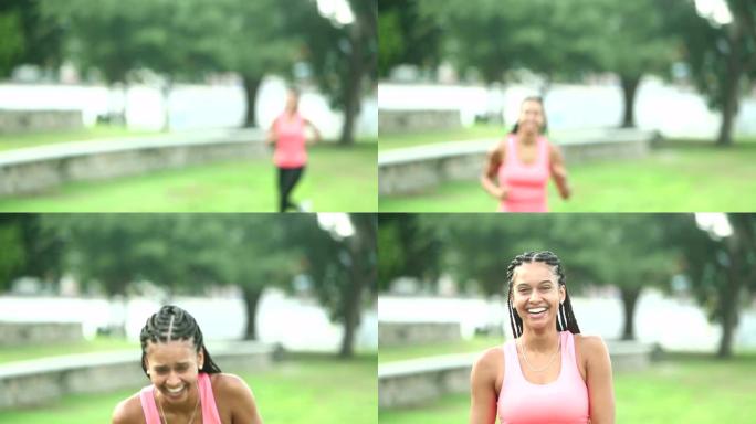 年轻漂亮的混血女子在公园里跑步