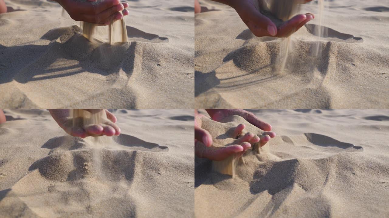 手里拿着沙子。慢动作。