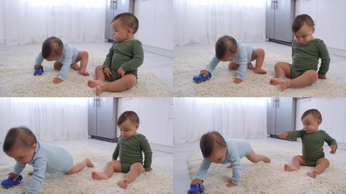亚洲双胞胎男婴与玩具车在地毯上玩耍