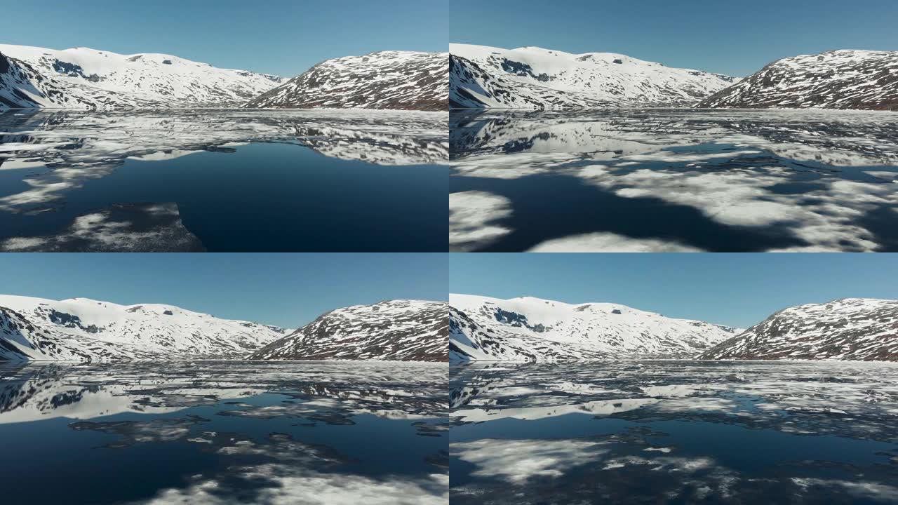 带着裂开的浮冰飞越春湖。挪威。UHD, 4K