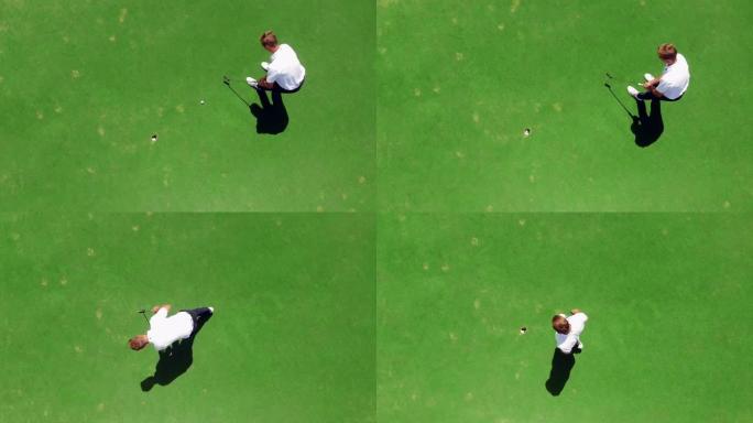 年轻的高尔夫球手在球场上练习，将球打入洞中。