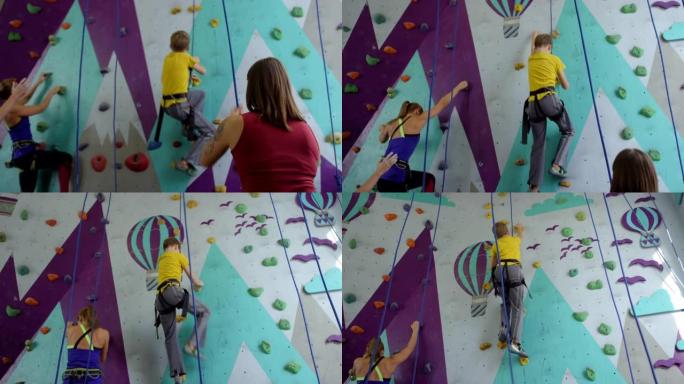 一群登山者在攀岩墙上练习