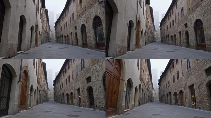意大利托斯卡纳圣吉米尼亚诺中世纪镇的空街。没有人，由于检疫的冠状病毒影响，所有关闭