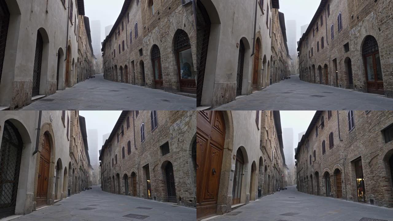 意大利托斯卡纳圣吉米尼亚诺中世纪镇的空街。没有人，由于检疫的冠状病毒影响，所有关闭