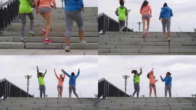 笑的女性慢跑者在桥顶上击掌