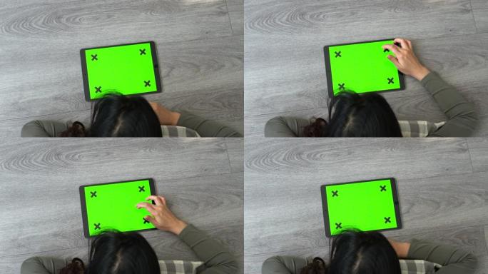 移动绿屏的女人看绿幕平板智慧学习