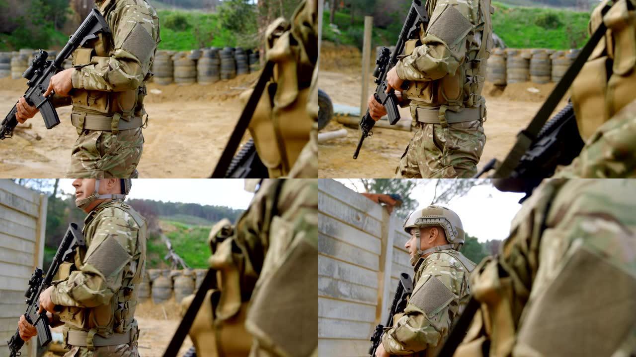 侧面的混合种族的军事士兵步枪训练在战场上军事训练4k