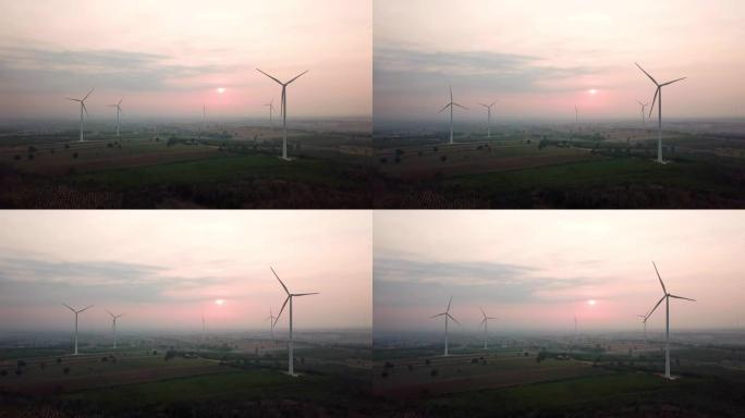 风力涡轮机替代能源的航拍，日出早晨