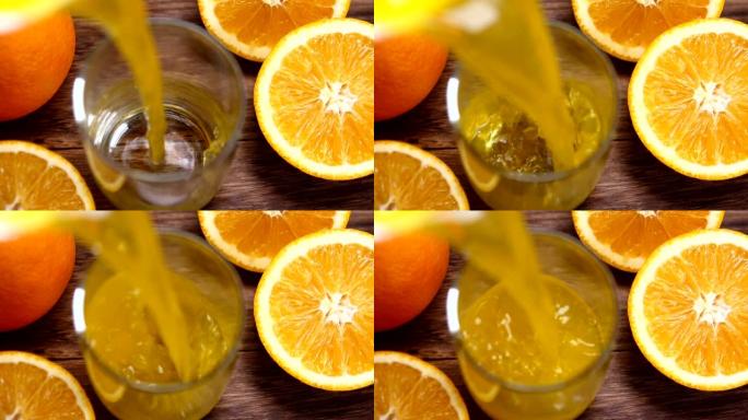 橙色juice pouring into cup