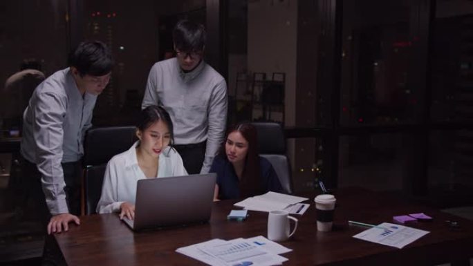4k解决方案东南东亚商务团队晚上在办公室开会商业伙伴讨论和头脑风暴计划投资财务分析概念亚洲商务室内生