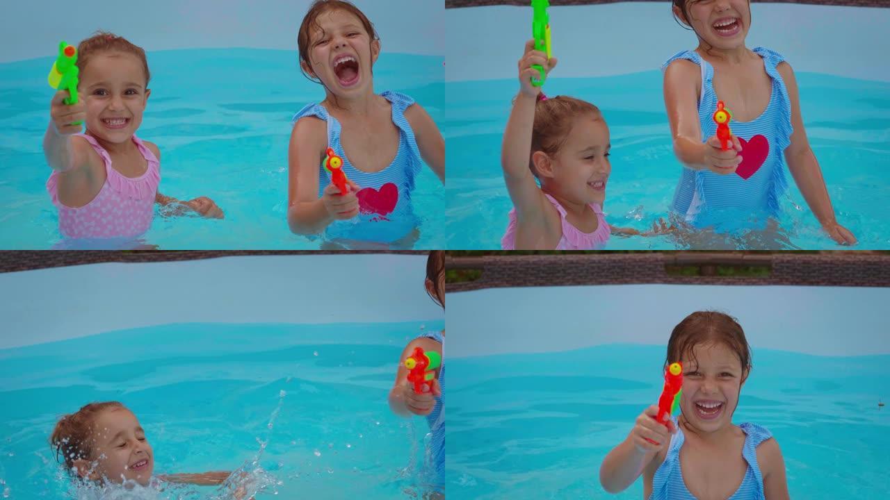 两个快乐微笑的小女孩姐妹在游泳池里玩水枪的真实时刻
