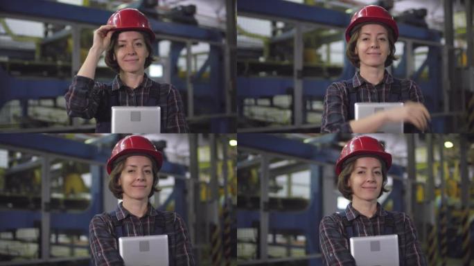 微笑的女工程师在工厂的自动化生产线前摆姿势