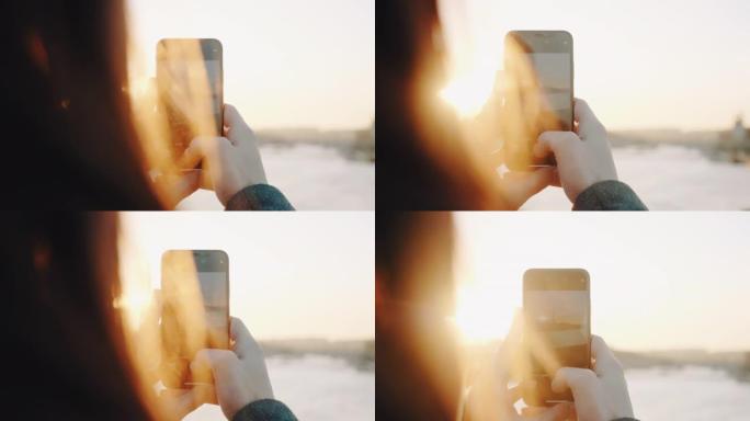 电影背光特写，快乐女人拍摄巴黎日落时塞纳河埃菲尔铁塔的智能手机照片