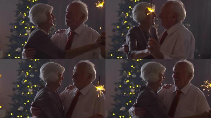 欢快的祖父母在平安夜跳舞