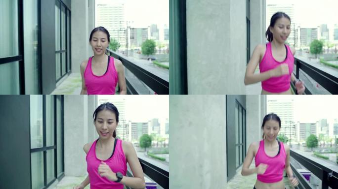 健康美丽的年轻亚洲跑步女子穿着运动服在城市的街道上跑步和慢跑。生活方式适合和积极的女性在城市概念中锻