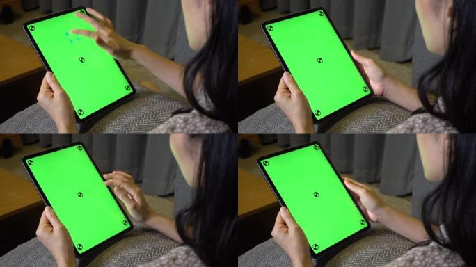 使用色度键屏幕数字平板电脑的女人