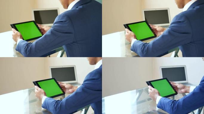 商人在平板电脑绿屏上寻找