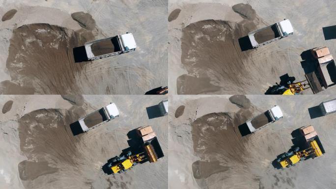 拖拉机用碎石和沙子装载机器。