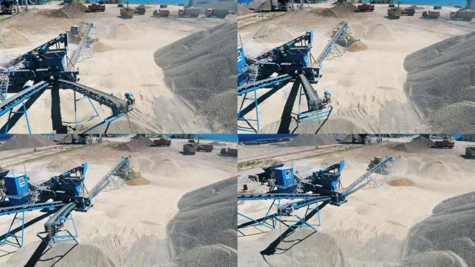 拖拉机在提取地点移动沙子。