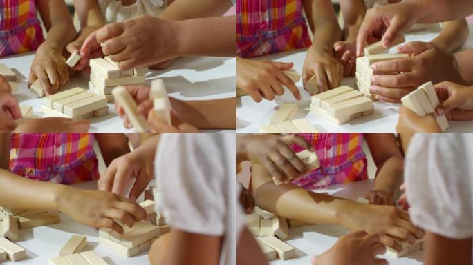 儿童之手建造玩具塔