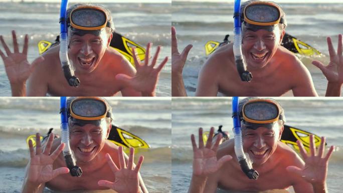 快乐的高级男子在浮潜面具潜水水下与热带。活跃的退休老人和有趣的概念在世界各地。真实的身体