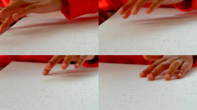 4k学校教室里盲人亚洲男生手读盲文的特写