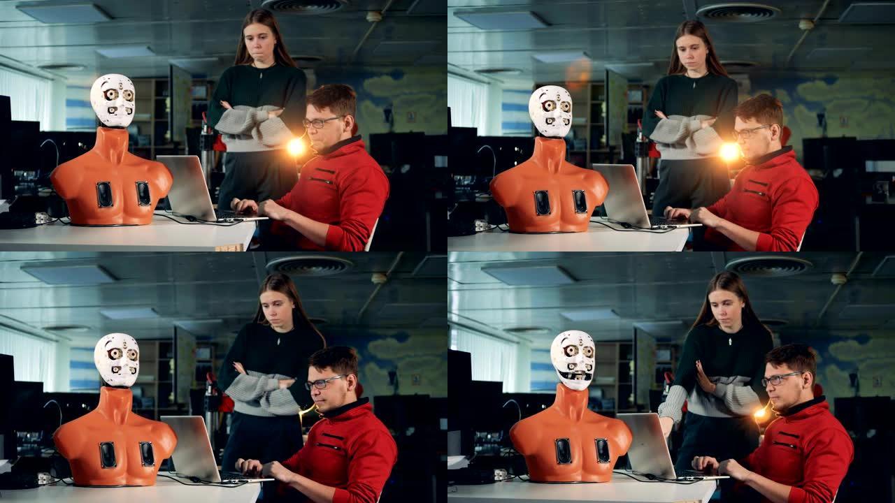 控制机器人的工程师使用笔记本电脑关闭。